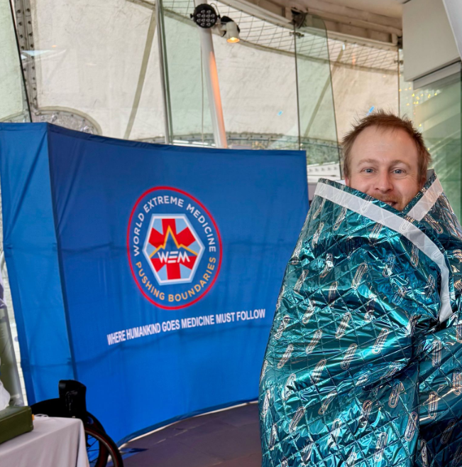A WEM conference attendee trying THERMARMOUR equipment in 2025